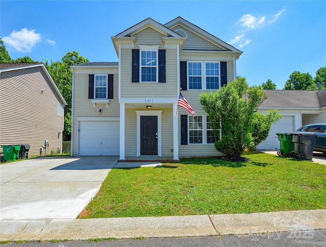 7311 Fig Ln, Charlotte, NC 28215 - view of front of home featuring driveway, a front lawn, and a garage