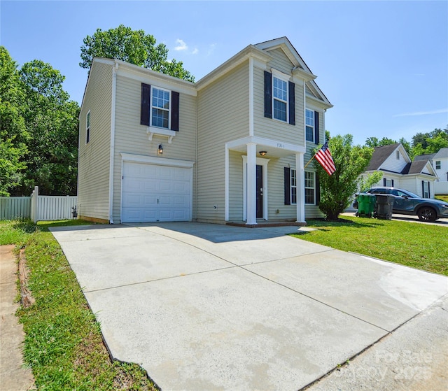 7311 Fig Ln, Charlotte, NC 28215 - traditional-style home featuring driveway, an attached garage, and a porch