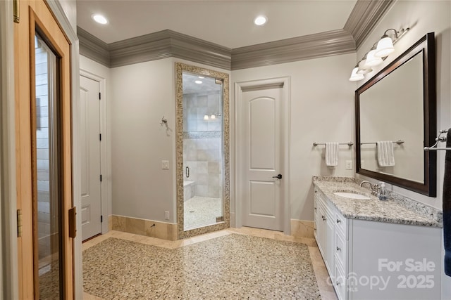 16909 Jetton Rd, Cornelius, NC 28031 - full bath featuring ornamental molding, baseboards, a shower stall, vanity, and recessed lighting