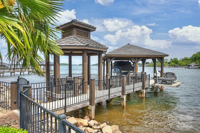 16909 Jetton Rd, Cornelius, NC 28031 - dock with boat lift, a water view, a gazebo, and fence