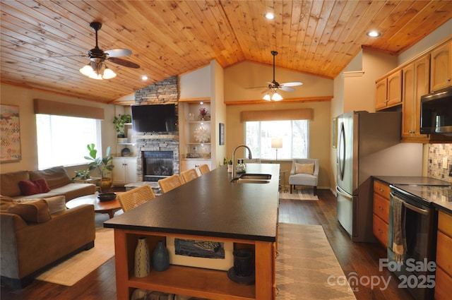 220 Woodwinds Ln, Seven Devils, NC 28604 - kitchen with a sink, appliances with stainless steel finishes, ceiling fan, open floor plan, and vaulted ceiling