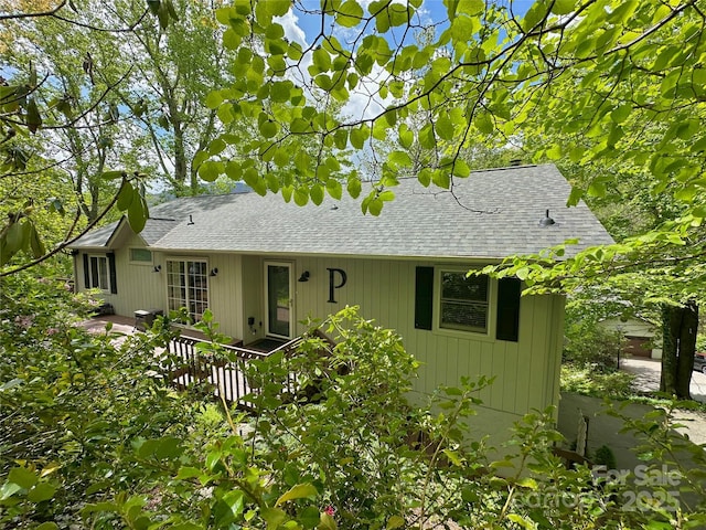 220 Woodwinds Ln, Seven Devils, NC 28604 - view of front of property featuring a shingled roof and a wooden deck