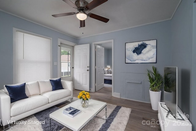 520 E Maple Ave, Gastonia, NC 28054 - living room featuring wood finished floors, ceiling fan, crown molding, and baseboards