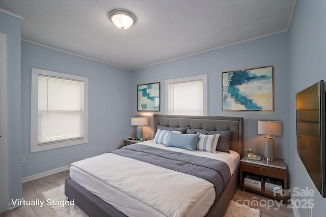 520 E Maple Ave, Gastonia, NC 28054 - bedroom with wood finished floors, ornamental molding, and baseboards