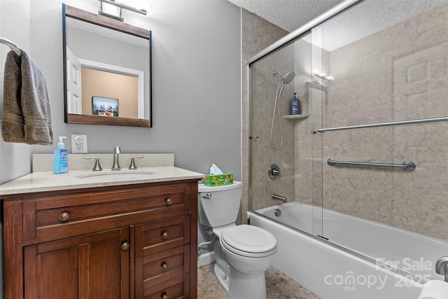 bathroom featuring vanity, toilet, bath / shower combo with glass door, and a textured ceiling