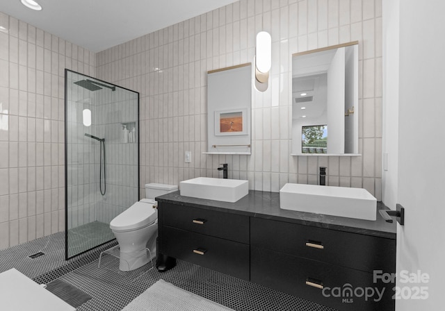 2913 Lake Ave, Charlotte, NC 28208 - full bathroom featuring tile walls, walk in shower, toilet, double vanity, and tile patterned floors