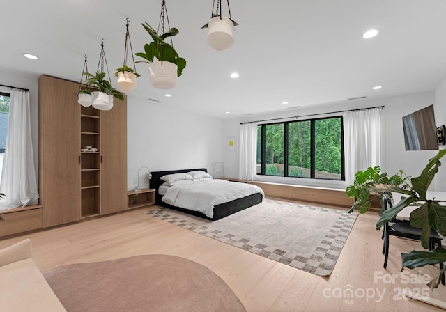 2913 Lake Ave, Charlotte, NC 28208 - bedroom with wood finished floors and recessed lighting