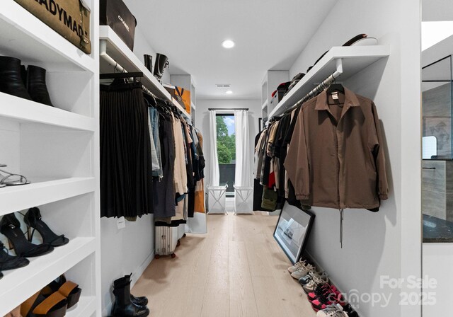 2913 Lake Ave, Charlotte, NC 28208 - walk in closet with wood finished floors