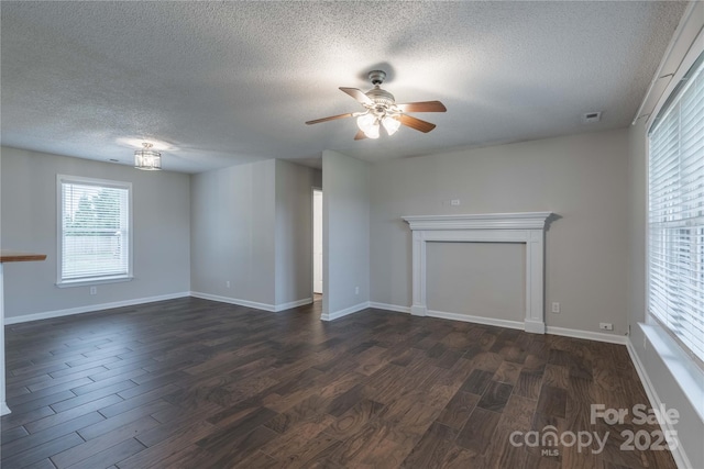 133 Pheasant Run Rd, Troutman, NC 28166 - unfurnished living room featuring a textured ceiling, dark wood finished floors, a ceiling fan, and baseboards