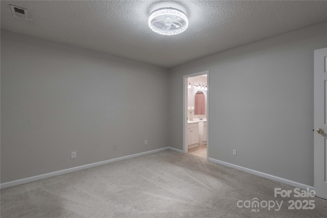 133 Pheasant Run Rd, Troutman, NC 28166 - empty room featuring light colored carpet, baseboards, and a textured ceiling