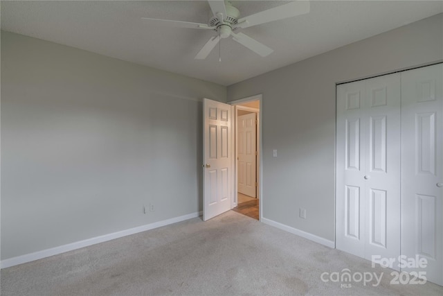 133 Pheasant Run Rd, Troutman, NC 28166 - unfurnished bedroom featuring carpet floors, baseboards, a closet, and a ceiling fan