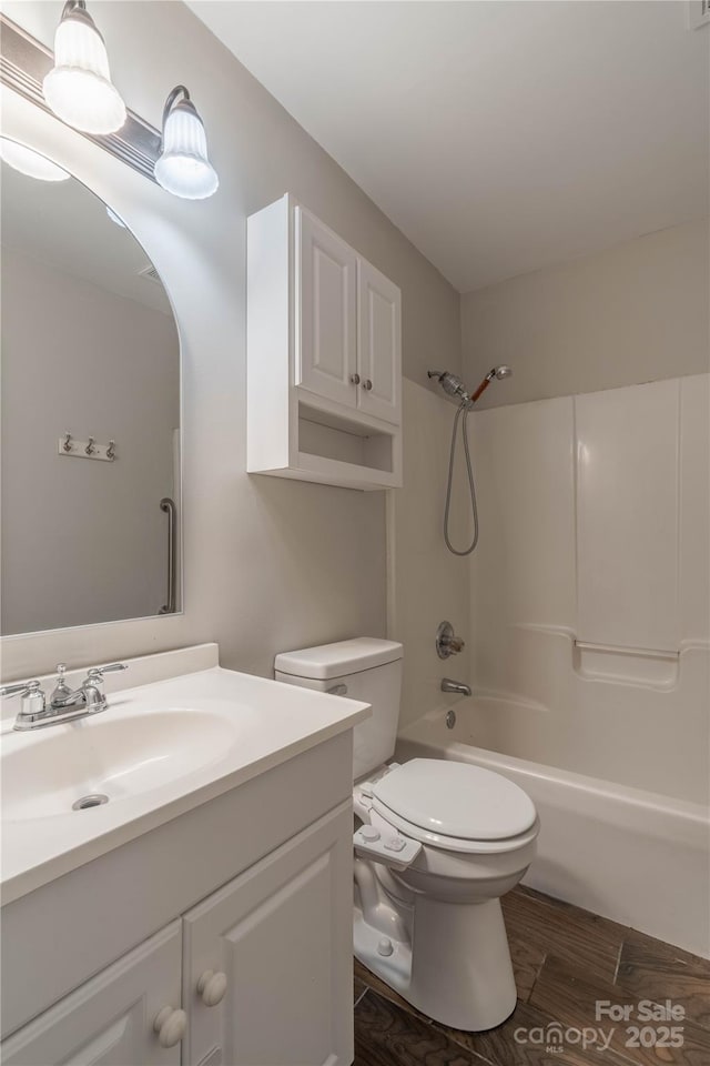 133 Pheasant Run Rd, Troutman, NC 28166 - bathroom featuring vanity, toilet, bathtub / shower combination, and wood finished floors