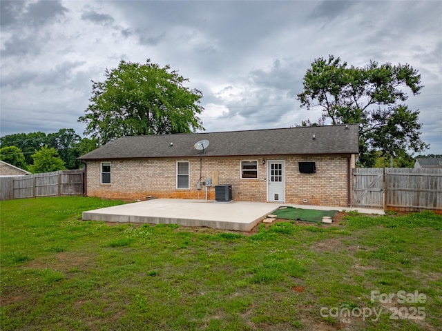 133 Pheasant Run Rd, Troutman, NC 28166 - back of property with brick siding, a patio, central AC unit, and a gate