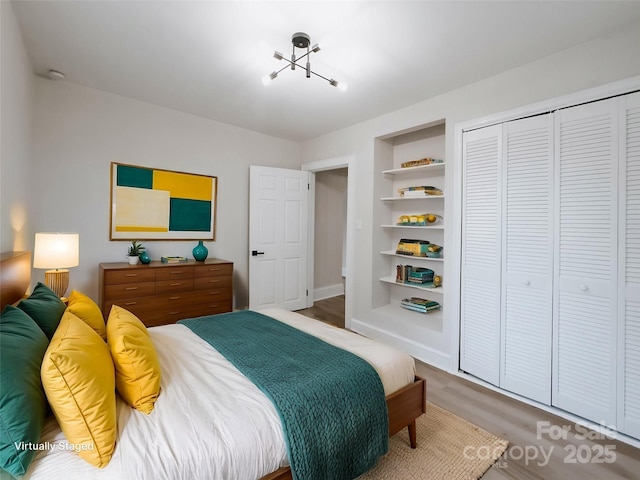 bedroom with a closet and wood finished floors