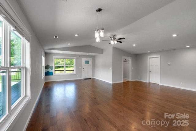 unfurnished living room with a ceiling fan, dark wood-style floors, vaulted ceiling, baseboards, and recessed lighting