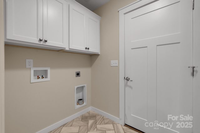 washroom with cabinet space, baseboards, electric dryer hookup, and washer hookup