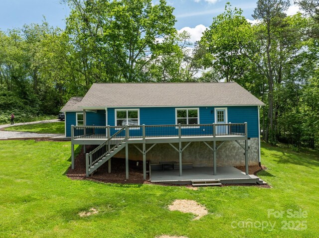 123 Dapple Rd, Candler, NC 28715 - rear view of property featuring a deck, a yard, stairway, a patio, and a shingled roof