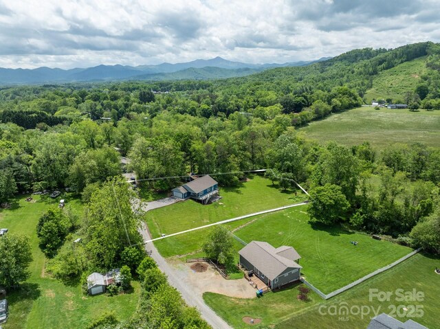 123 Dapple Rd, Candler, NC 28715 - aerial view of property and surrounding area with a heavily wooded area, mountains, and property boundaries highlighted