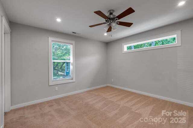 123 Dapple Rd, Candler, NC 28715 - spare room with light colored carpet, baseboards, ceiling fan, and recessed lighting