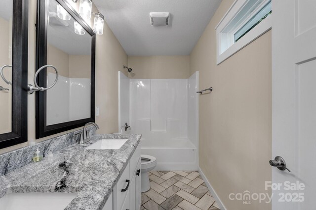 123 Dapple Rd, Candler, NC 28715 - bathroom featuring toilet, vanity, bathtub / shower combination, and baseboards
