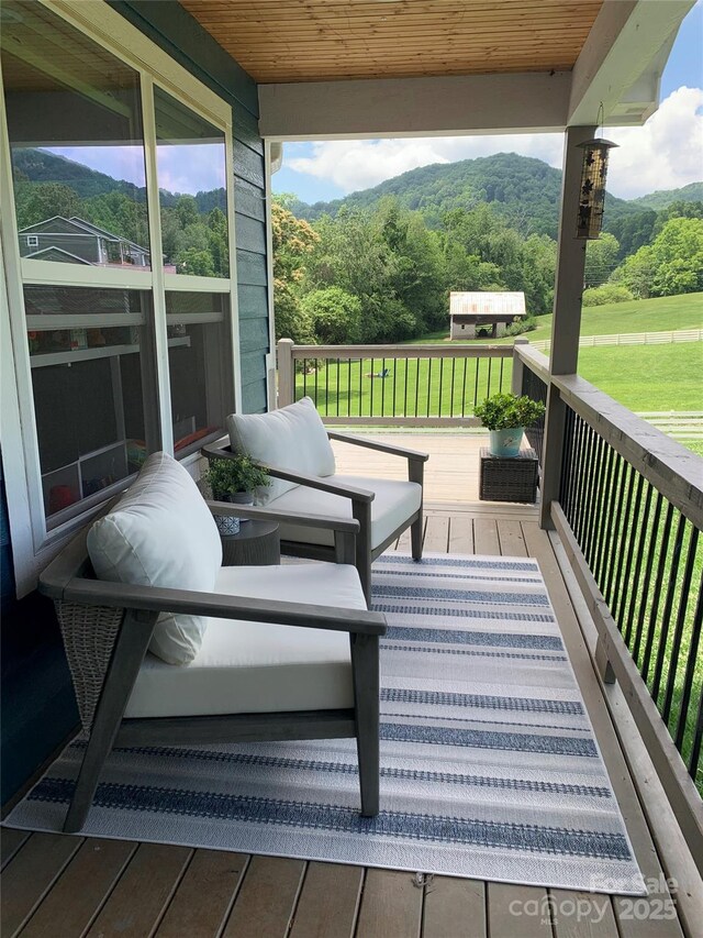 123 Dapple Rd, Candler, NC 28715 - wooden terrace featuring a wooded view and a yard