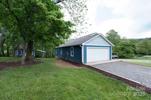 123 Dapple Rd, Candler, NC 28715 - view of side of property featuring central air condition unit and a garage