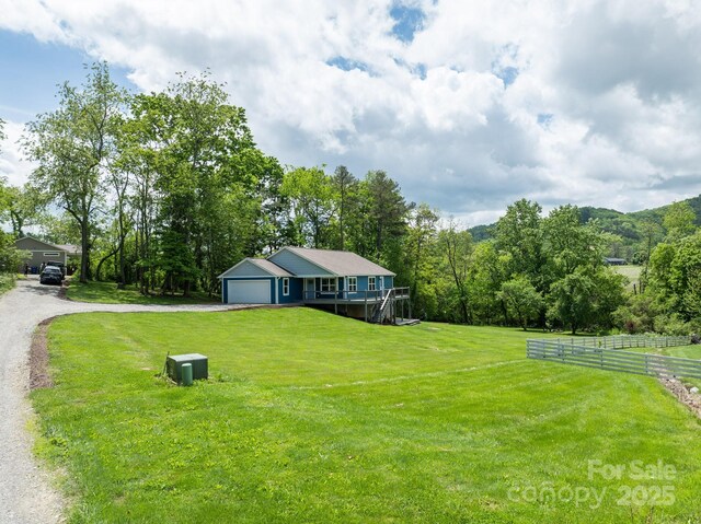 123 Dapple Rd, Candler, NC 28715 - view of yard featuring driveway and a garage