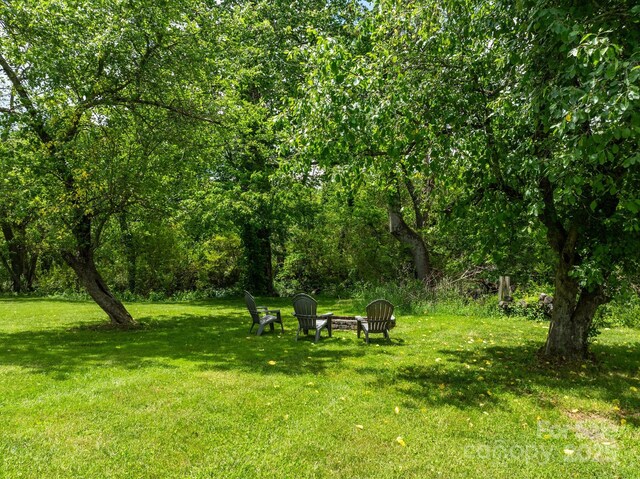 123 Dapple Rd, Candler, NC 28715 - view of green lawn with a fire pit