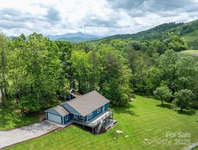 123 Dapple Rd, Candler, NC 28715 - aerial view of property and surrounding area with a heavily wooded area and a mountain backdrop