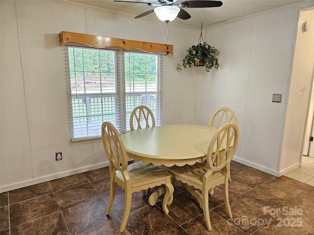 3191 Piedmont Rd, Morganton, NC 28655 - dining room with a ceiling fan, crown molding, and baseboards