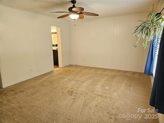3191 Piedmont Rd, Morganton, NC 28655 - unfurnished room with ceiling fan, light carpet, and a textured ceiling