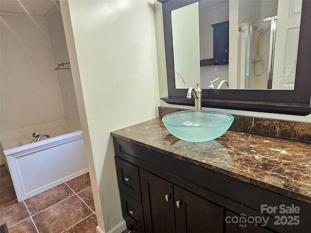 3191 Piedmont Rd, Morganton, NC 28655 - bathroom with vanity, a stall shower, a bathtub, and tile patterned floors