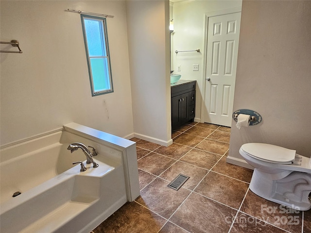 3191 Piedmont Rd, Morganton, NC 28655 - full bathroom featuring vanity, a bath, tile patterned flooring, toilet, and baseboards