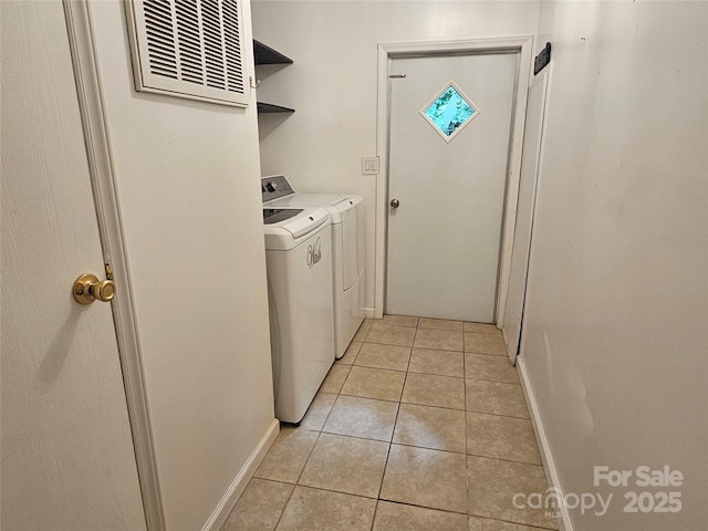 3191 Piedmont Rd, Morganton, NC 28655 - laundry room with independent washer and dryer, light tile patterned floors, and baseboards