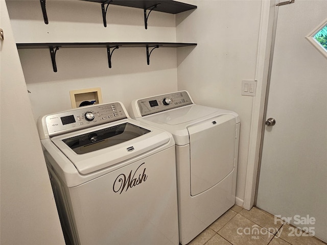 3191 Piedmont Rd, Morganton, NC 28655 - washroom with separate washer and dryer and light tile patterned floors