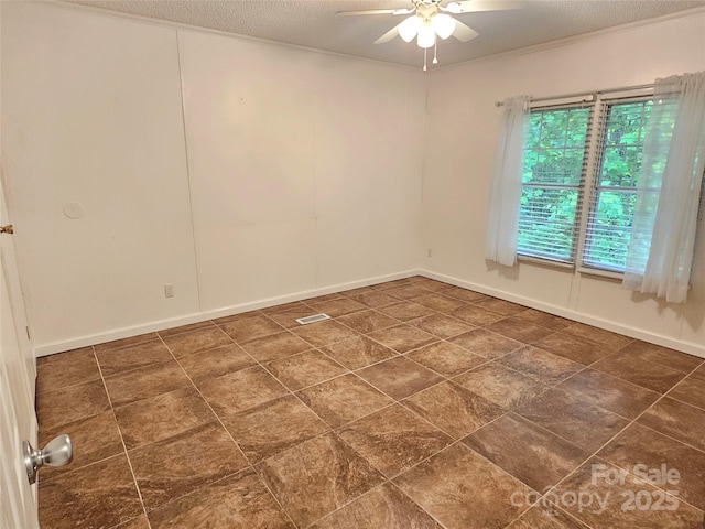 3191 Piedmont Rd, Morganton, NC 28655 - spare room with a ceiling fan, baseboards, a textured ceiling, and dark tile patterned floors
