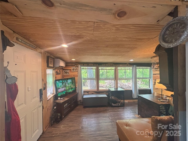 living room with wooden ceiling, plenty of natural light, dark wood finished floors, a wall mounted air conditioner, and recessed lighting