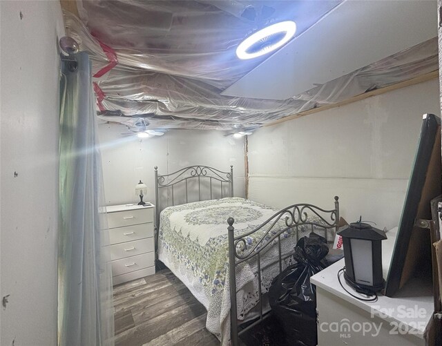 bedroom with wood finished floors
