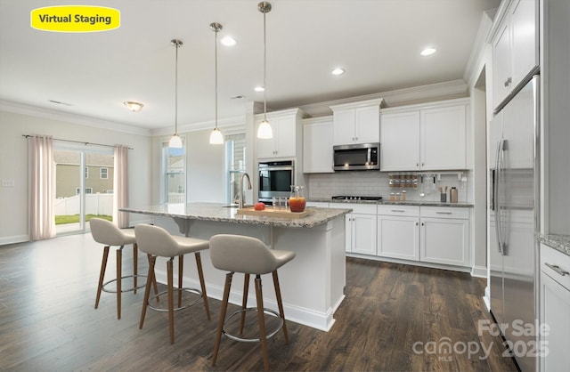 145 Yellow Birch Loop, Mooresville, NC 28117 - kitchen featuring stainless steel appliances, ornamental molding, dark wood-type flooring, decorative backsplash, and white cabinetry
