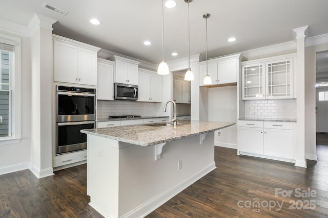 145 Yellow Birch Loop, Mooresville, NC 28117 - kitchen with appliances with stainless steel finishes, a sink, tasteful backsplash, white cabinets, and crown molding