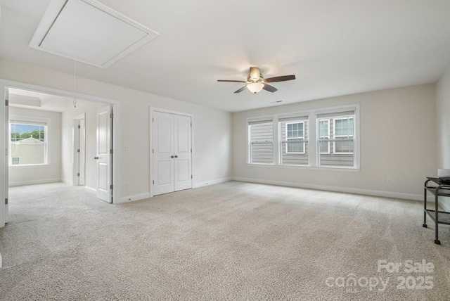 145 Yellow Birch Loop, Mooresville, NC 28117 - unfurnished bedroom with attic access, carpet flooring, baseboards, ceiling fan, and a closet