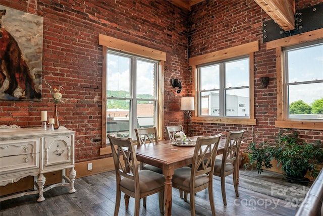 14 N Main St Unit 2, Waynesville, NC 28786 - dining space featuring brick wall, hardwood / wood-style floors, and plenty of natural light