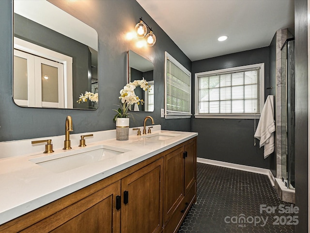 4315 Poplar Grove Dr, Charlotte, NC 28269 - bathroom with a stall shower, double vanity, and recessed lighting