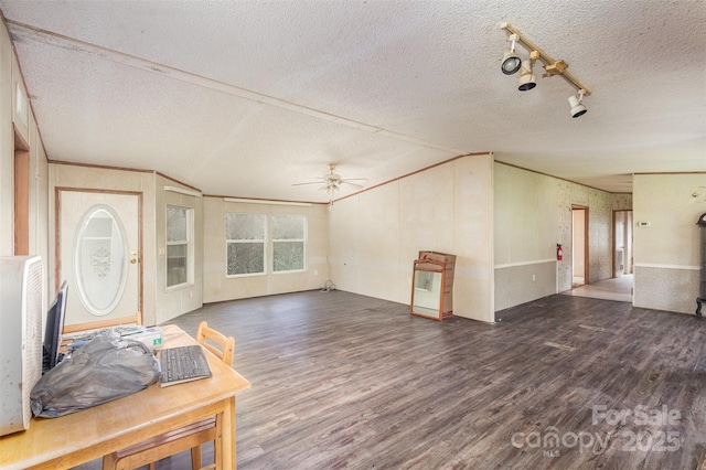 entryway with wood finished floors, ceiling fan, a textured ceiling, and lofted ceiling