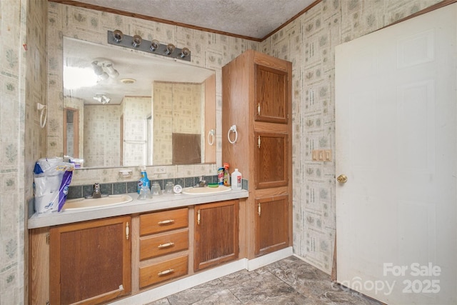 full bath featuring wallpapered walls, ornamental molding, and double vanity
