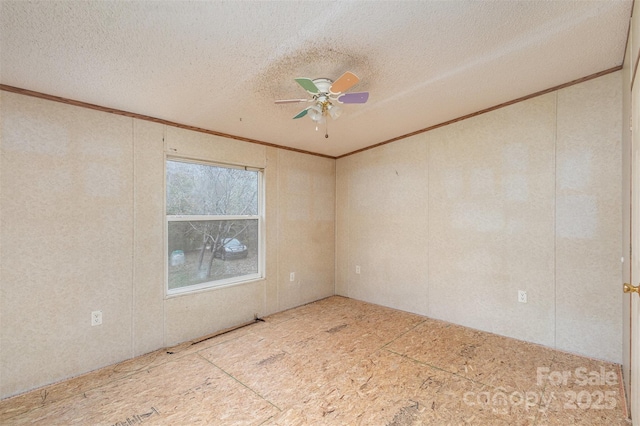 unfurnished room featuring crown molding, ceiling fan, and a textured ceiling