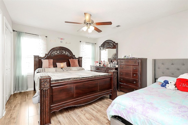 bedroom featuring light wood-type flooring and ceiling fan
