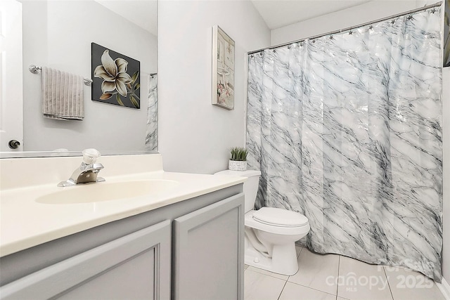 bathroom featuring vanity, toilet, tile patterned floors, and a shower with shower curtain