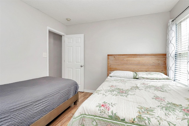 bedroom featuring wood finished floors