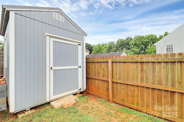 view of shed with fence